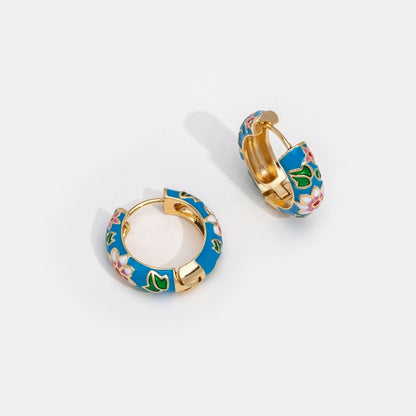 Pendientes de aro dorado con flor